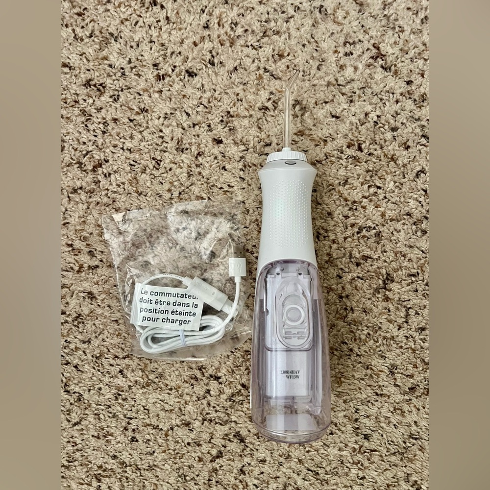 White and Purple Oral Irrigation Appliance